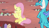 Fluttershy nuzzling a dragon egg S9E9