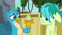 Gallus holding a quill-covered cupcake S8E2