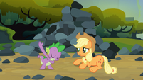 Spike bowing to Applejack.