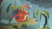 The dragon being confronted by Fluttershy.