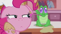 Gummy licking the cream off of Pinkie's face S5E8