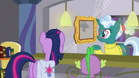 Librarian looking at Twilight's wall photo S9E5