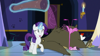 Rarity walks away with rolled-up carpet S6E21