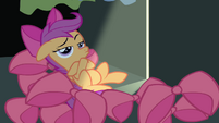 Scootaloo lying on Apple Bloom's bows S4E17