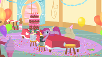 Pinkie Pie laying on the table with derpy eyes S1E25