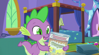 Spike holding a mint-in-bag comic book S5E19