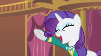 Rarity singing with her hoof pointing up S4E14