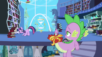 Twilight asks Spike to look for "Predictions and Prophecies" book S1E01