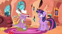 Twilight backing away from Spike.