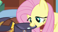 Fluttershy closing up her saddlebag S6E17