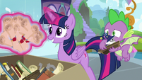 Twilight levitating her old school scrolls S9E5