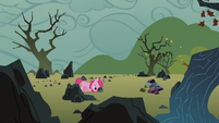 Filly Pinkie pushing a rock S1E23