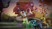 Ponies in costumes outside Fluttershy's cottage S5E21