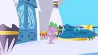 Spike carrying gift box to Twilight's house S1E01