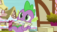 Spike guesses himself with flyer in his mouth S7E9