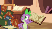 Spike showing the book to the ponies S3E05