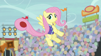 Fluttershy holding a ball with her tail S9E6