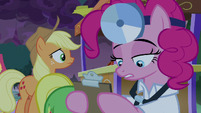 Nurse Pinkie looking at a clipboard S9E17