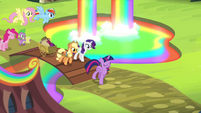Main Six and Spike entering the Rainbow Falls Traders Exchange S4E22