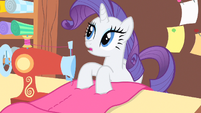 Rarity hears her doorbell ring.