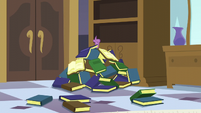 Spike stuck under the book pile S5E10