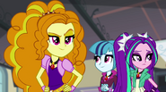 Dazzlings watch the arguing students EG2