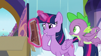 Twilight Sparkle looking at the photo S9E5