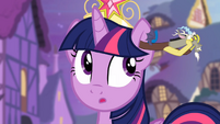 Twilight Sparkle looking surprised with Discord in her right ear S04E02