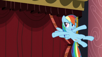 Rainbow in front of curtain S5E15