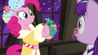 Spirit of HW Presents holding up toy duck S6E8