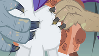 Their claws are digging into Rarity's coat.