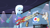 Trixie looking down at guitar EG2