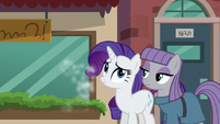 Maud and Rarity standing together while Pinkie runs off S6E3