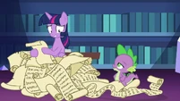 Twilight Sparkle in a pile of lesson scrolls S7E1