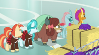 Cheer squad looking over at Snips S9E15