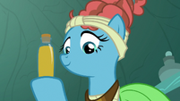Mage Meadowbrook holding a bottle of honey S7E20