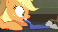Applejack with dustpan as dust is being swept to it S6E9