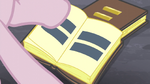 Pinkie flipping through book pages with equal signs S5E02
