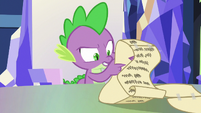 Spike reading his notes closely S6E22