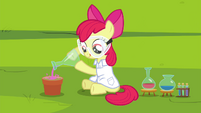 Apple Bloom putting liquid substance onto potting soil S4E15