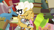 Goldie Delicious tightly hugging her cats S7E13