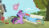 Twilight Sparkle patting Rainbow Dash's head S2E03