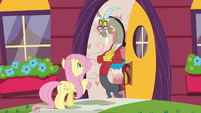 Fluttershy greets Discord outside his door S7E12