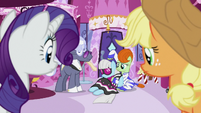 Rarity and Applejack look at unconscious Photo Finish S7E9