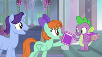 Spike giving out school booklets S8E1