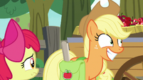 Applejack grinning at Big McIntosh S9E10