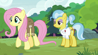 Fluttershy carries Lola the sloth to the tree S7E5