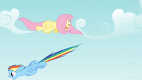Rainbow dashes past Fluttershy.