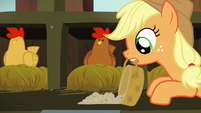Applejack spreads chicken feed in front of brown chicken S6E10