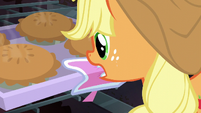 Applejack takes tray of pies out of the oven S6E10